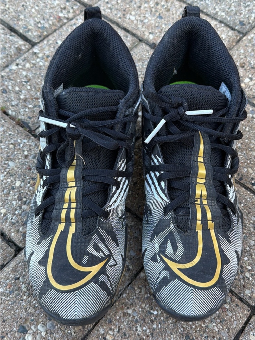 Boys Black and Gold Nike football cleats